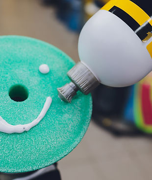 Car detailing - Hands with orbital polisher in auto repair shop. Selective focus.jpg