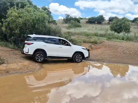 Toyota Fortuner completing water crossing during 4x4 Off-Road Training at Hennops River Valley with SA Adventure