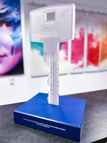 Shown here is a single production of a key for the company Abus. It was printed directly onto 10mm acrylic and the base was UV-DD printed with white lettering.
