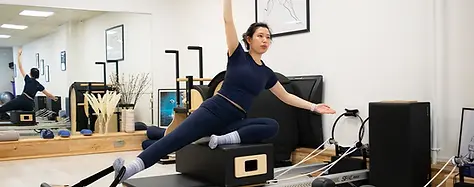 INFINITY-PILATES-REFORMER-CLASSES-WOOD-GREEN.webp