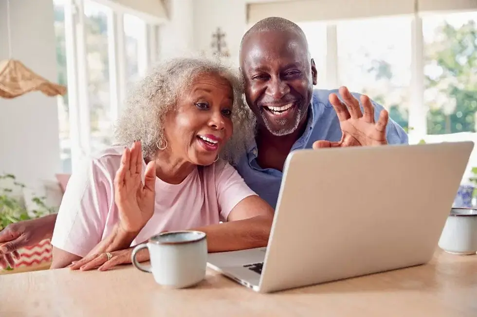 A senior couple learning to use a Zoom with tech support help