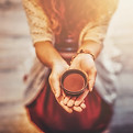 Cacao ceremony, heart opening medicine. Ceremony space. Cacao cup in woman's hand..jpg
