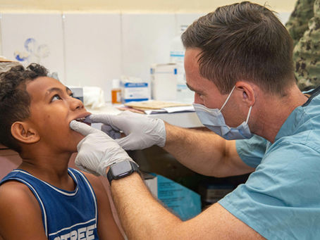 A dentist treating a child. Aminya St Dental