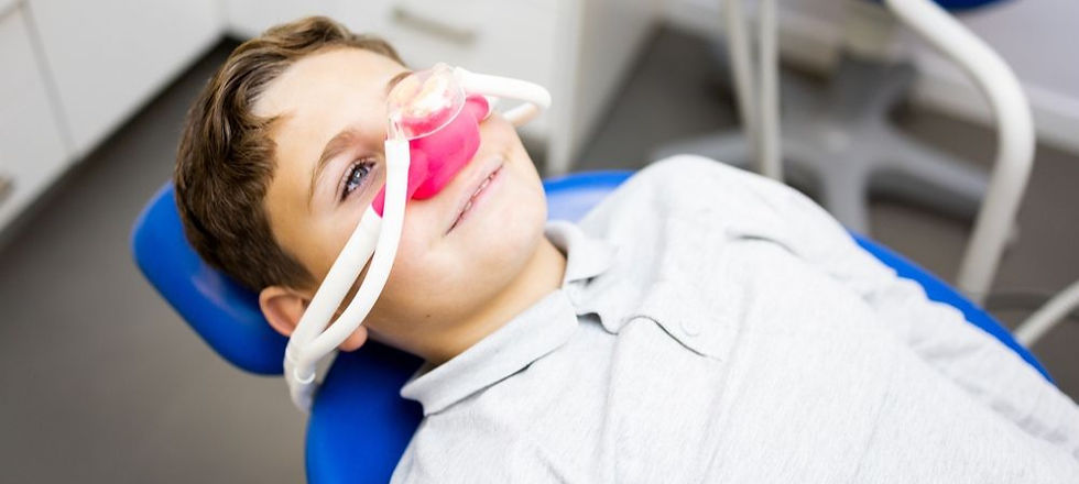 A child on a dentist char using happy gas. Aminya St. Dental, Brisbane.
