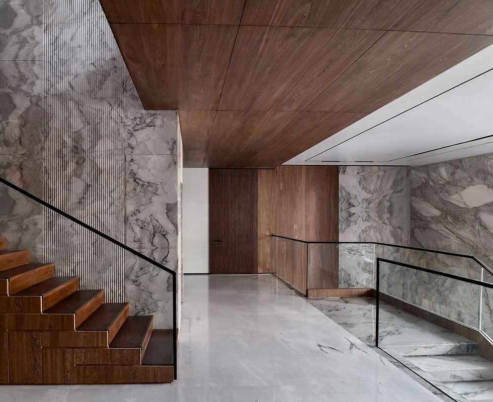 A striking architectural view of a custom marble and wood staircase, serving as a visual metaphor for building a strong layout and foundation when learning how to write an About page-how-to-write-interior-design-about-page