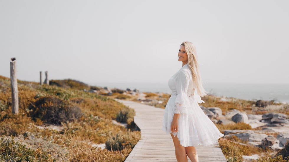 Kim Tresfon walking on the beach boardwalk