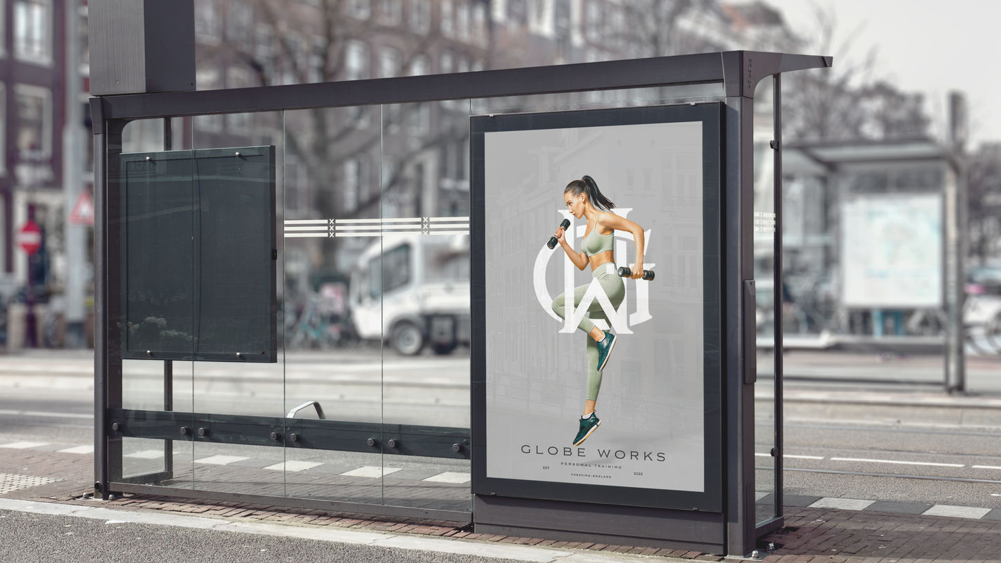 Globe Works brand poster mockup on bus shelter — outdoor advertising design by White Stone Atelier
