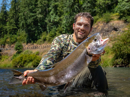 Gabe Robinson Holding His First Steelhead