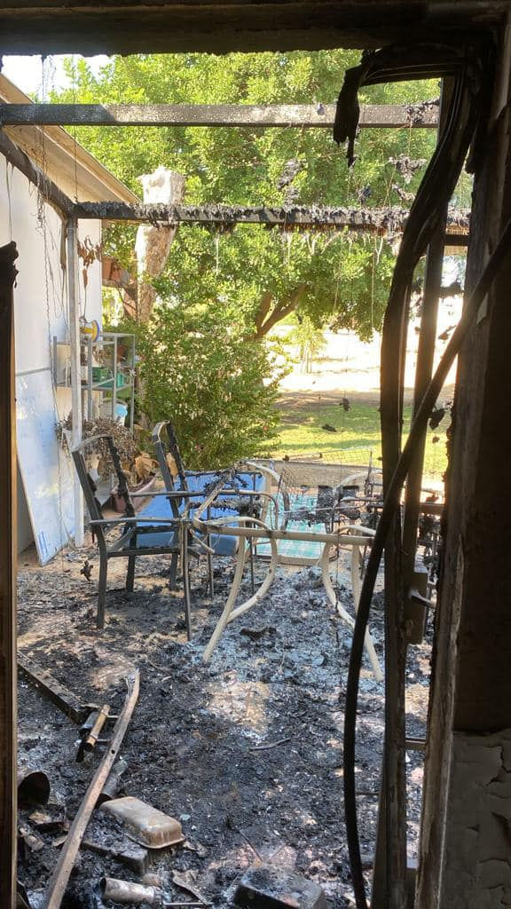 Burnt chairs and table in Jude's house