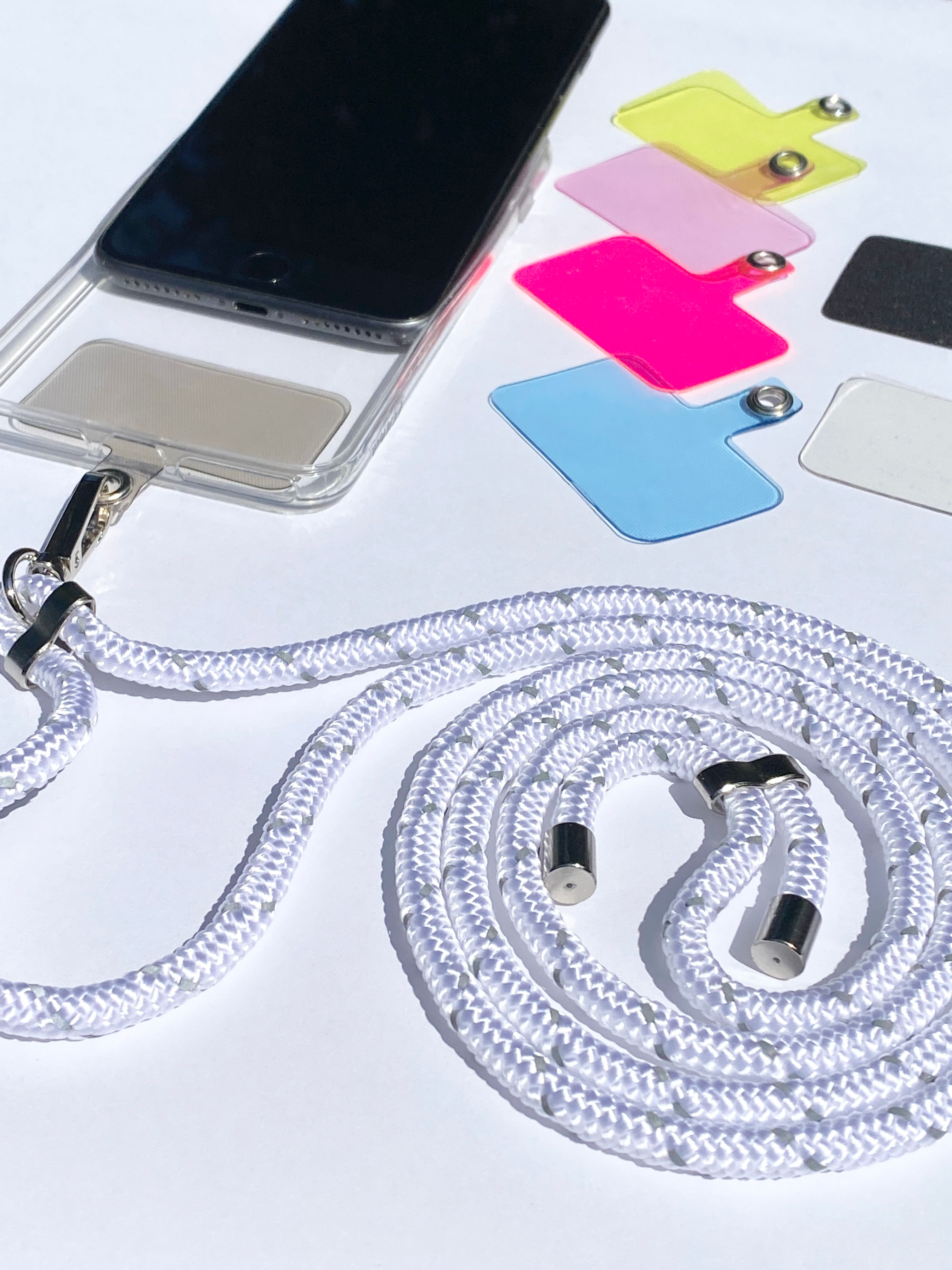 white reflective phone strap