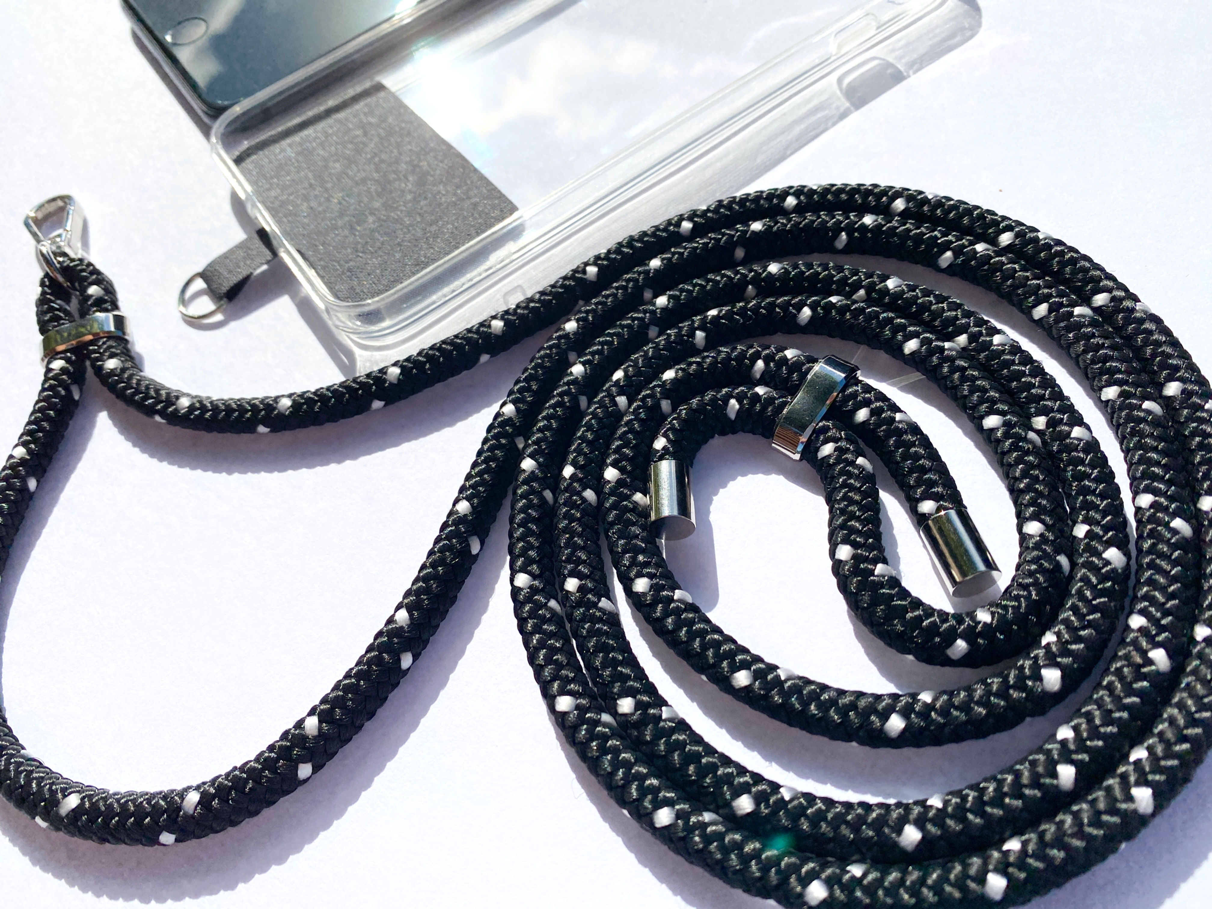 black with white dots phone strap