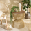 Thumbnail: Natural Rattan Side Table Malik with teak wood top next to the chair