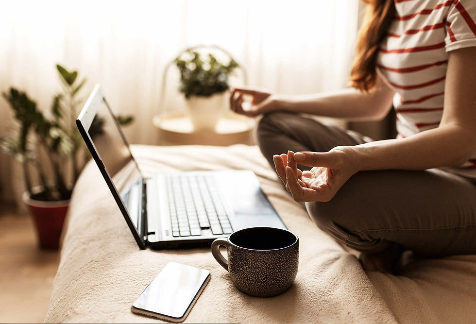 Person calmly reviewing documents and notes at a desk after discovering a cryptocurrency scam, focusing on next steps.