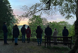 Group of people looking over Winchester at sunrise