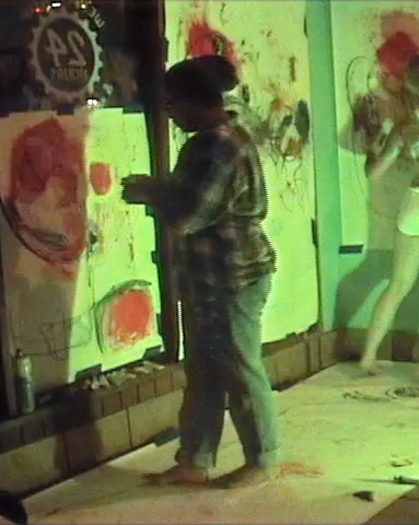 Haas dancing and painting at Shot in the Dark Cafe in Tucson Arizona