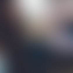 boy smilees at camera on an outdoor family photo shoot