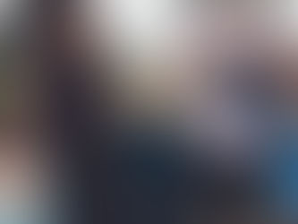 boy smilees at camera on an outdoor family photo shoot