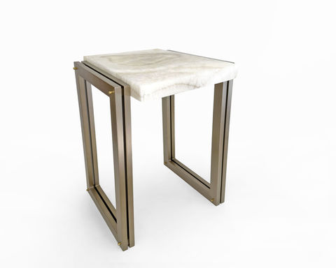 This side table featuring a natural onyx top and a plated metal base. Each stone top is unique, and the base is available in a variety of custom finishes to suit your space. Sculptural, versatile, and handcrafted, it’s designed to add a polished statement to exceptional interiors.