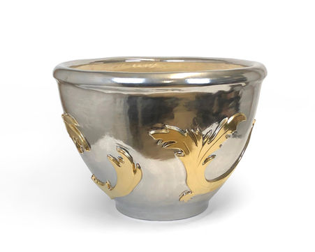 Exuding Italian sophistication, this ceramic planter showcases refined style and elegance in every detail.
Shown in platinum finish with 22k satin gold accent.
24"W x 18"H
*Discover all available finishes under the finish options tab.