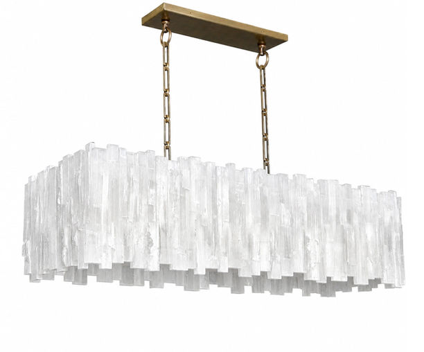 Rectangular selenite chandelier handcrafted from natural selenite crystal rods and suspended from a burnished brass canopy and chain. The layered design creates a cascading architectural silhouette while diffusing a warm ambient glow through the translucent mineral.