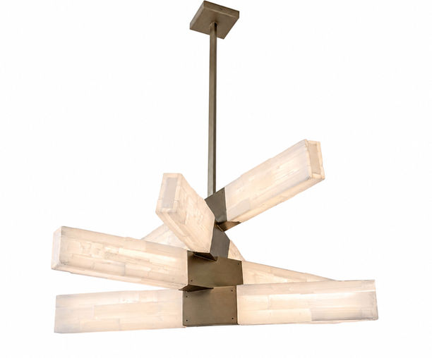 Lucca selenite chandelier featuring illuminated natural selenite crystal bars arranged in a sculptural radial composition around a satin champagne metal framework. This handcrafted luxury chandelier combines geometric design with the organic translucency of natural stone, creating a dramatic contemporary lighting statement.