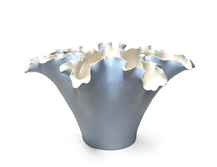 The Calypso Vase features a graceful flared silhouette crowned with delicately sculpted ruffled edges.