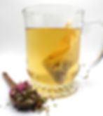 Thumbnail: clear glass mug with tea inside wooden spoon with herbs