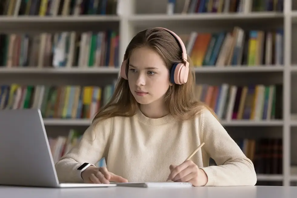 Teen student working with an online reading tutor on a laptop