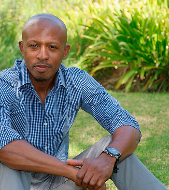 Image of man sitting on grass.