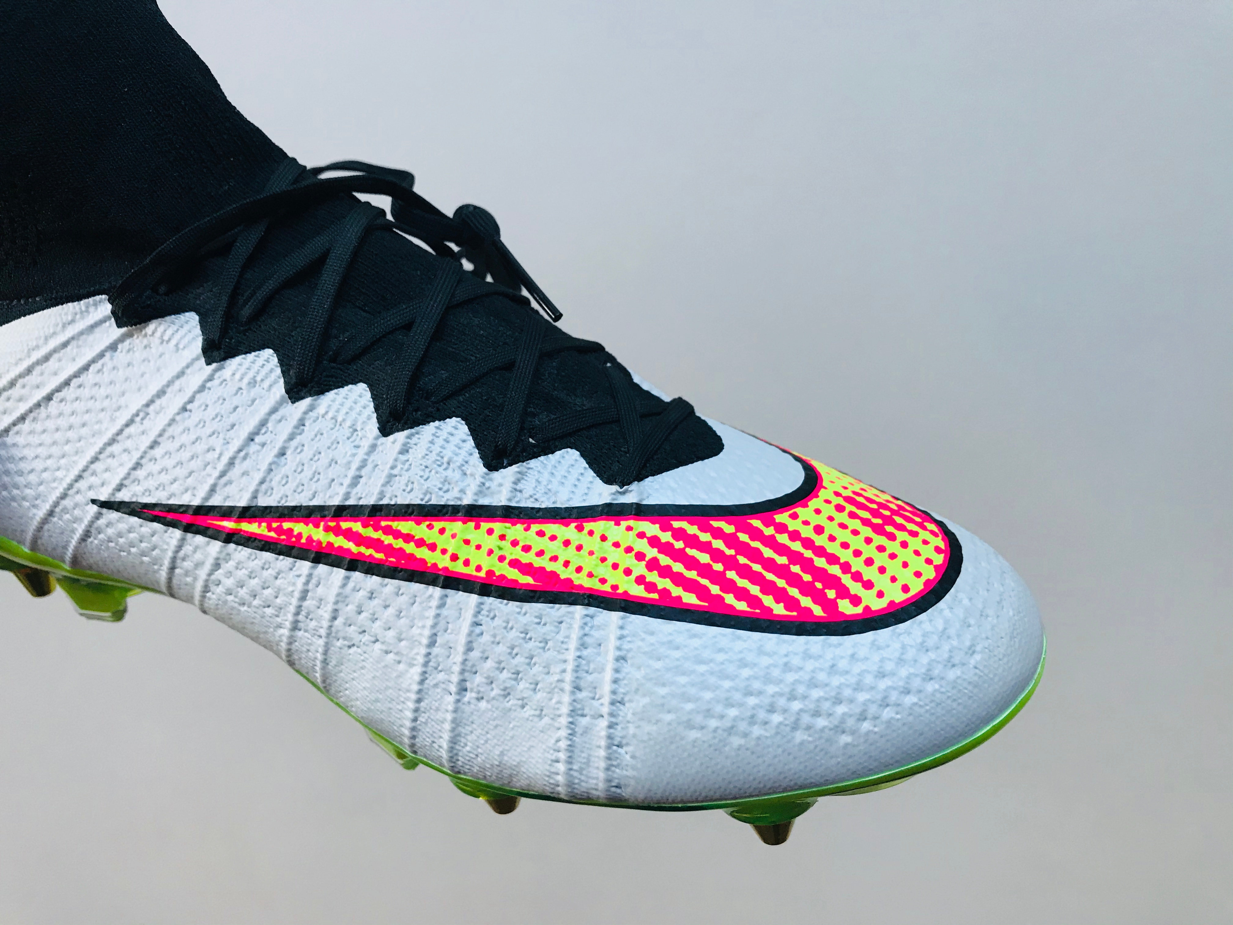 white and pink mercurials