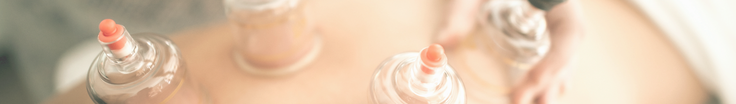clear glass bottle on brown wooden table