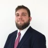 A portrait of a man in a suit.