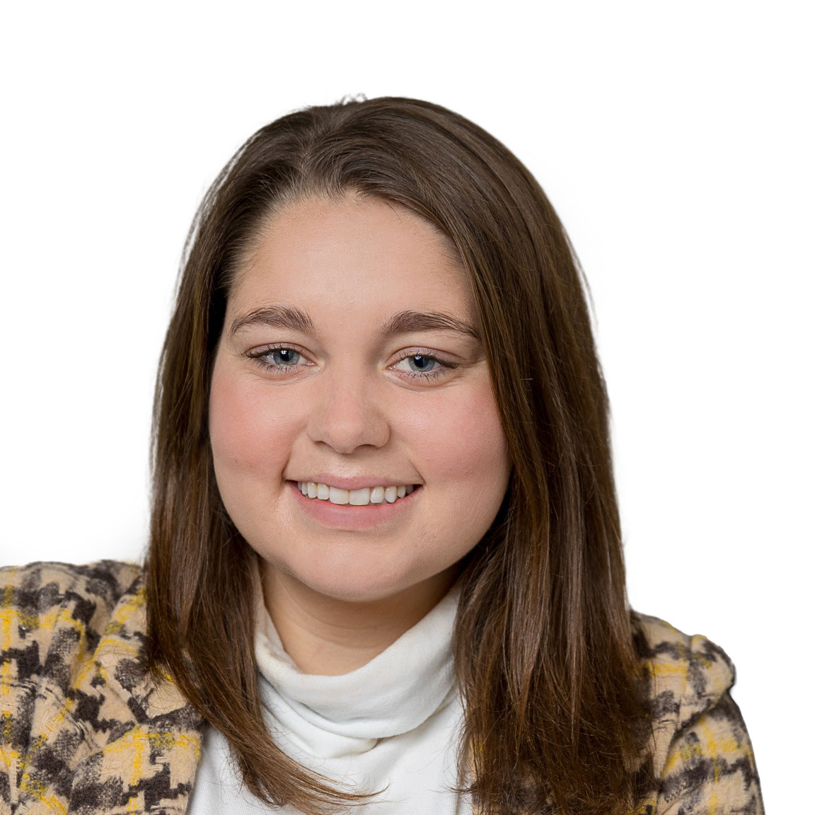 Professional headshot of a woman smiling in a studio setting