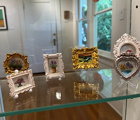 Display of original miniature watercolor paintings by Lorena Sliffe Preciado.