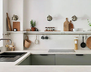 Claire Douglas' kitchen with brass hanging rail