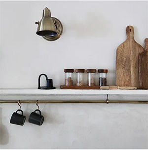 Antique hanging rail under kitchen shelf