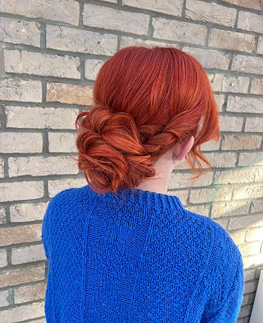 redhead-curly-bun-hairstyle
