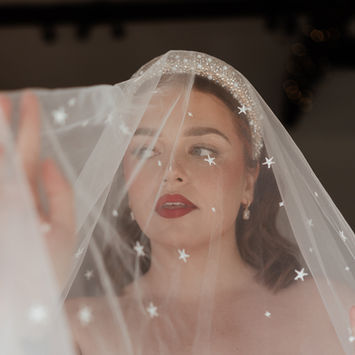 bride with red lips under celestial veil