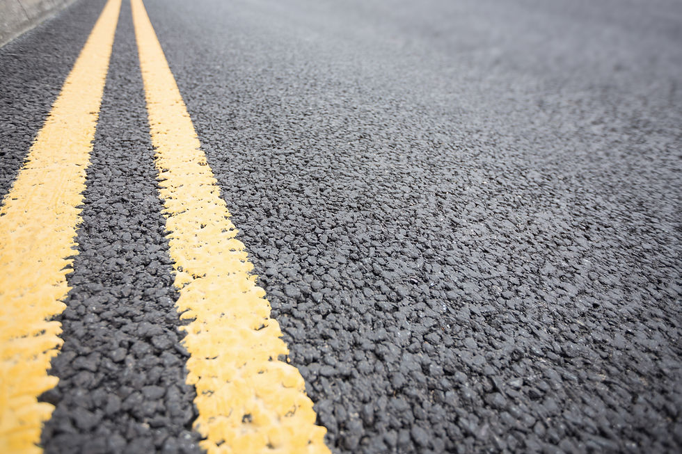 yellow-road-marking-on-road-surface.jpg