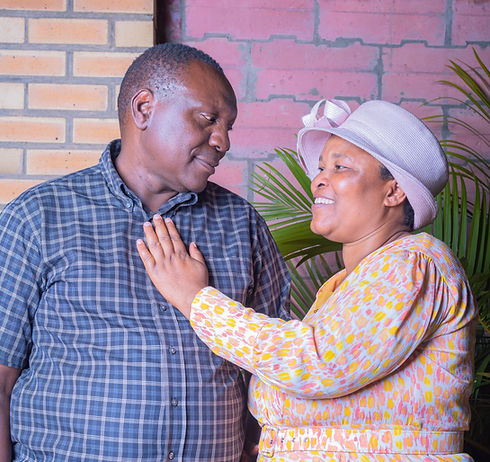 This is a portrait image of an older couple showing love that I took