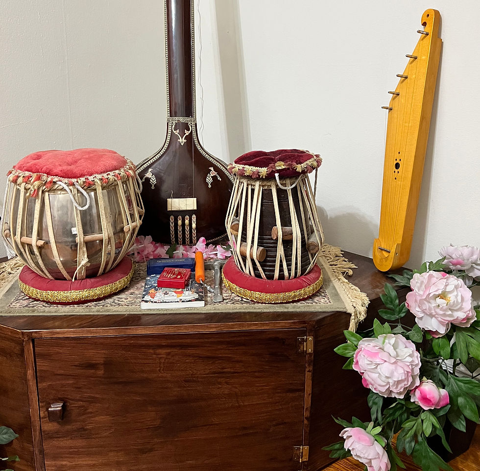Kantele, tabla drums, tanpura, and musical altar setup with flowers, created for the AOS Perspectives Blog post "Music: Kantele and the Lifelong Bond of Sound".