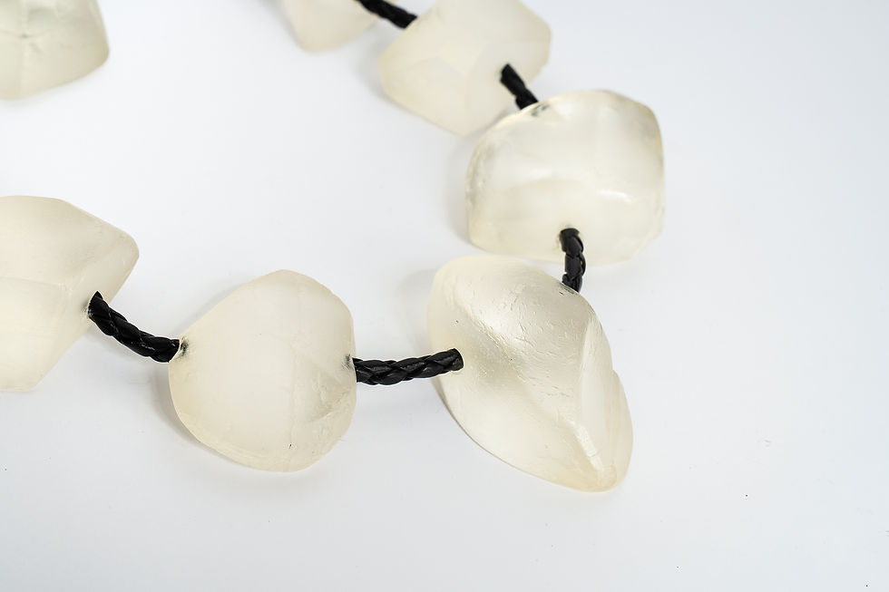 Close-up of Frost necklace by Rawa, showing the raw frosted texture of each resin nugget on leather