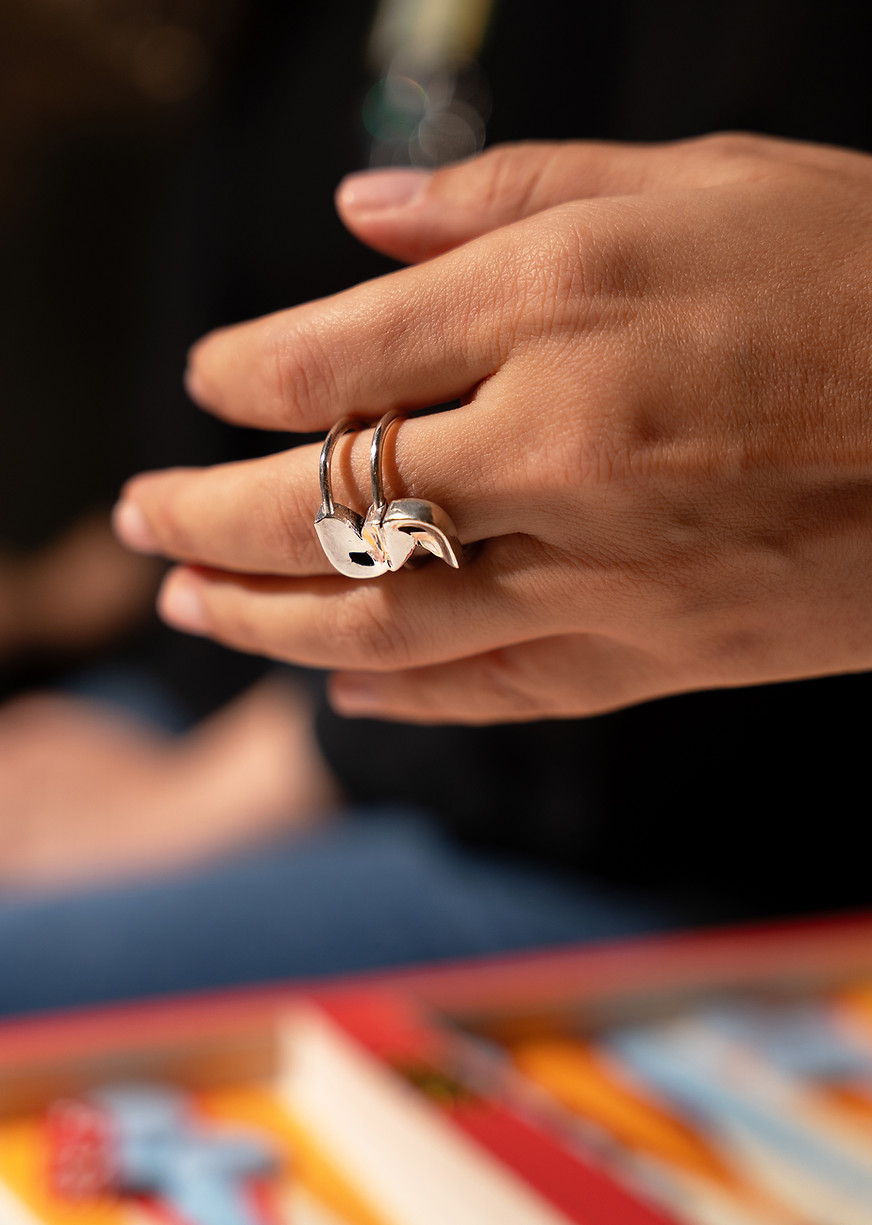 Handcrafted silver swan-shaped ring by Rawa, worn on hand