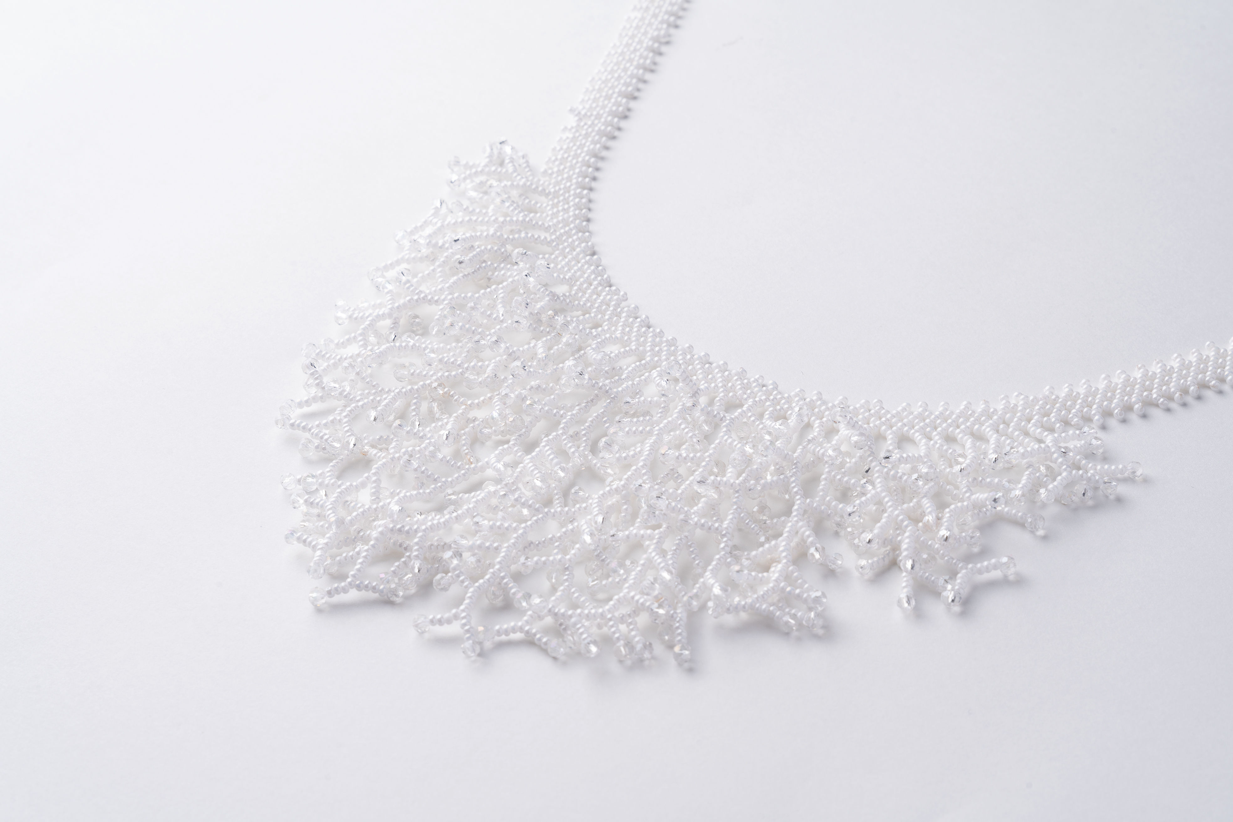 Rooted Bloom handcrafted coral beaded necklace in white
