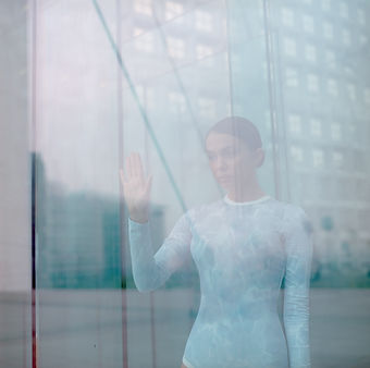 Girl Touching Window