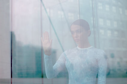 Girl Touching Window