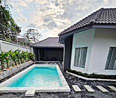"Modern 4BR pool villa in Srisuk Village, Pattaya, with private pool, European kitchen, and landscaped garden, ideal for living and rental"