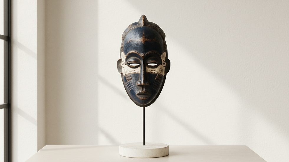 eye-level view of traditional African wooden mask displayed on a stand