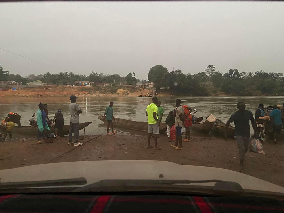 African's crossing a river in their canoes and boats