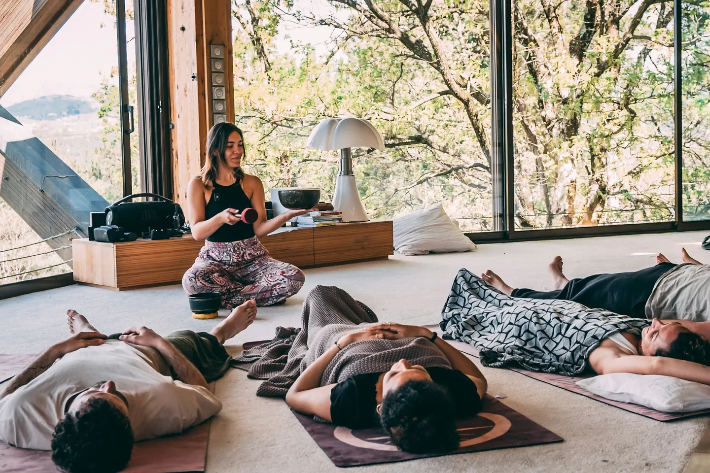 Guided group meditation in a sunlit room